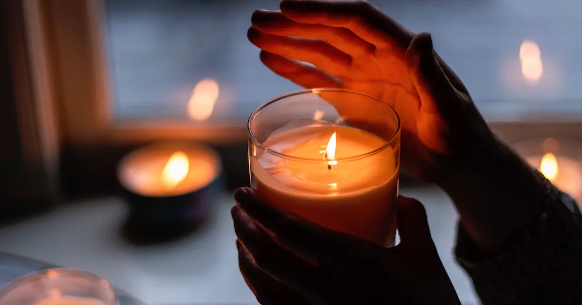 A person lighting candles