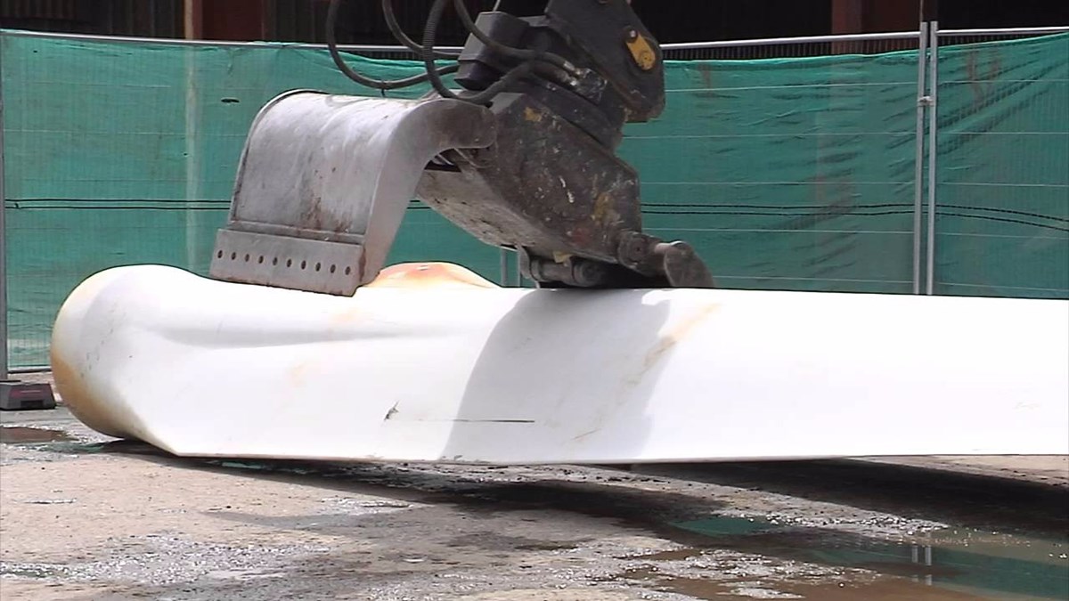 Fiberglass boat being destroyed