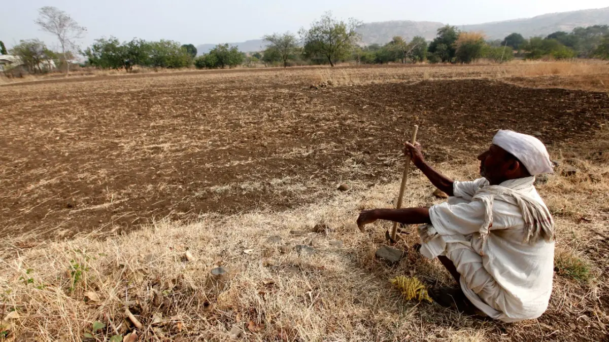 farmer tilling dry farmland